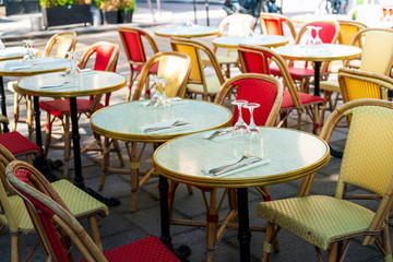 Street view of a coffee terrace with tables and chairs, Paris, France