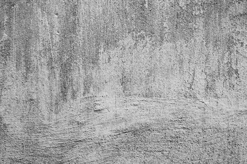 Texture of a concrete wall with cracks and scratches which can be used as a background