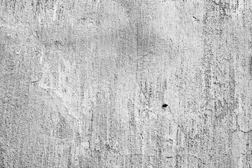 Texture of a concrete wall with cracks and scratches which can be used as a background