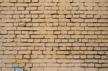 Fototapeta na wymiar Brick wall of the house painted with paint