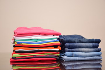 Set of Colorful polo t-shirts and many shades of blue jeans trousers   isolated in style light jeans and dark jeans , Fashion trends of  denim jean pants, fashion tops concept 