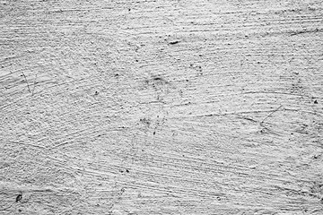 Texture of a concrete wall with cracks and scratches which can be used as a background