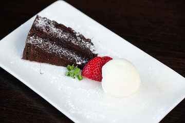 Chocolate cake with ice cream and strawberry