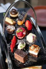 Indian style afternoon tea desserts with stand