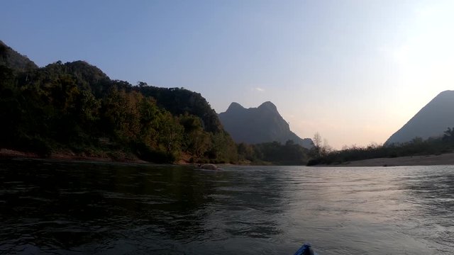 Albino Water Buffalo mother and calf crossing river Muang Ngoi Laos