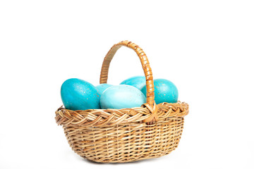 Fototapeta na wymiar Easter eggs in a basket on a white background, place for text, top view, isolation,