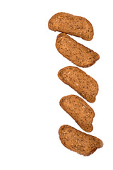 Fototapeta na wymiar Slices of sliced ​​Dutch grain bread lie on white background