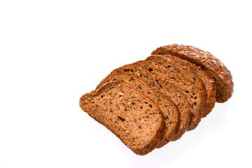 Slices of sliced ​​Dutch grain bread lie on white background