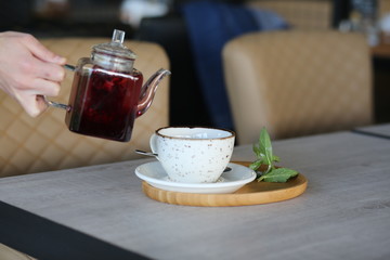 cheese cake next to herbal tea