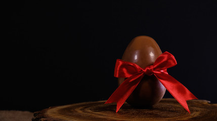 chocolate Easter egg with red bow