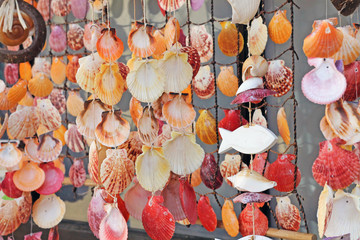 Fishing net with sea shells decoration close up.