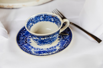 An empty teacup in the colors of Delft Blue