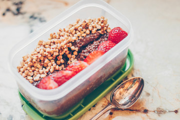 Vegan chocolate chia puggin with strawberries and buckwheat