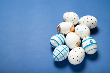 Easter eggs on a blue background, Place for text, Top view,