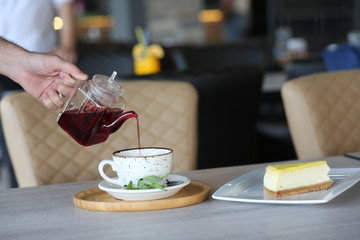 cheese cake next to herbal tea