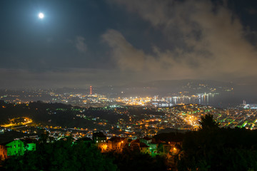 La Spezia seen from the hills on a night with full moon