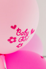 Pink balloon with text 'Baby girl' written on it