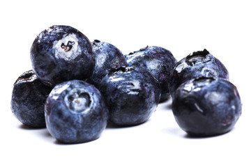 a handful of blueberries close-up isolated on white background