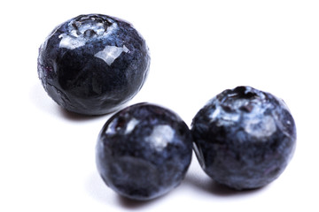 a handful of blueberries close-up isolated on white background