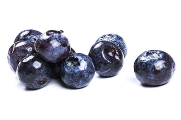 a handful of blueberries close-up isolated on white background