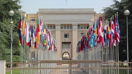 United Nations Headquarters office in Geneva, Switzerland. Looking at all the flags of the UN - Stock Video Clip Footage