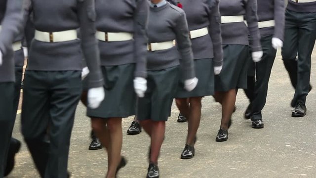 Royal Air Force Officers parade through the streets in homecoming parade. They march in formation in uniform. Marching. Stock Video Clip Footage
