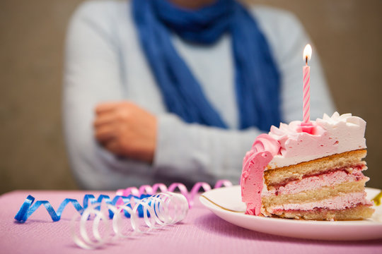 Lonely Sad Woman And Birthday Cake With Burning Candle