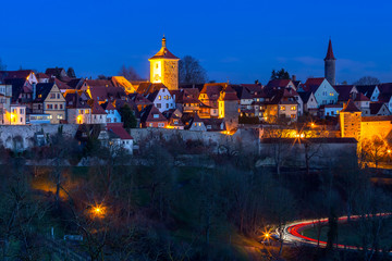 Night aerial view of roofs, towers and town wall in medieval Old Town of Rothenburg ob der Tauber, Bavaria, southern Germany