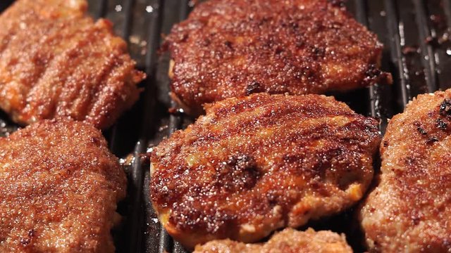hot testy juicy fried hamburger Patty with a crisp brown rust lying. fried meat in a pan