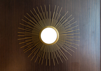 Decorative wall round mirror in the shape of the sun at condo, modern shape style.