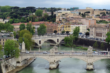 Fototapeta na wymiar Aerial view on two bridges: the Ponte Principe Amedeo Savoia Aosta and the Ponte Vittorio Emanuele II in front of the city in Rome, Italy, Europe