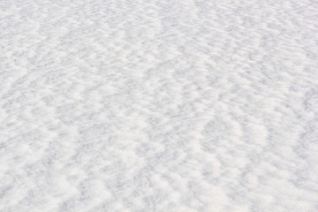White snow surface background - top view of fresh snow texture on the ground