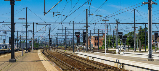 Panoramic landscape of railroad tracks with the catenary.