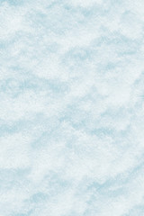 Blue snow surface background - top view of fresh snow texture on the ground