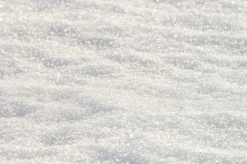 White snow surface background - top view of fresh snow texture on the ground