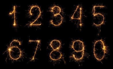 Set of burning sparkler numbers from 0 to 9 made of bengal fire, sparkler fireworks candle isolated...