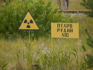 Radiation warning sign with the name - "Red Forest" in the Ukrainian language.