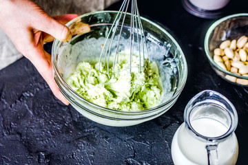 organic ice cream homemade process on dark background with hands