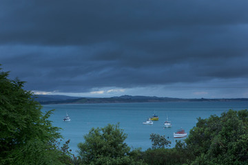 Moeraki coast New Zealand bay with boats