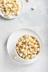 Fototapeta na wymiar Salt popcorn in the light bowl