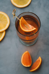 Aperol spritz cocktail with oranges and ice in wine glass. Summer refreshing drink