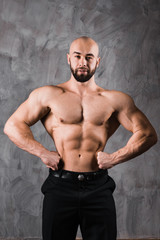 handsome muscular stylish bald man