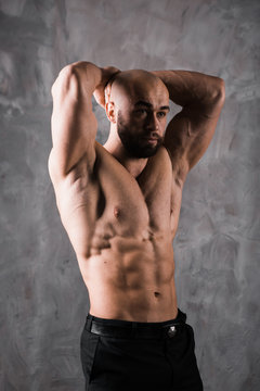 handsome muscular stylish bald man