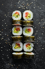 Vegetarian sushi with avocado and tomatoes. Sushi Set. Top view. Free space for your text