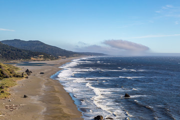 Looking along the Oregon coast at Nesika Beach, on a sunny summers day