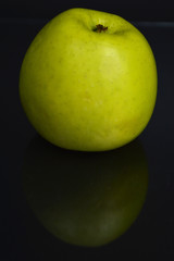 green apple on black background