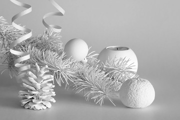 Fototapeta na wymiar Christmas white still life with balls, spruce branch and cone. New Year's still life.