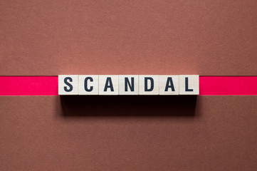 Text Scandal concept on cubes