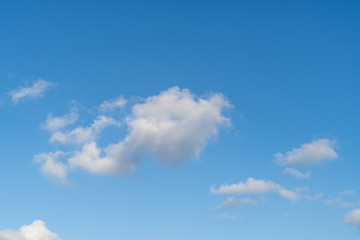 Naklejka na ściany i meble Blue sky with a little white cloud background