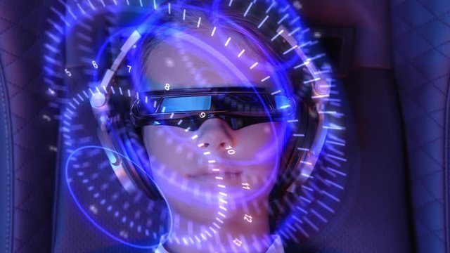 Girl with AR headset plunges into augmented virtual reality. Futuristic monitor on face with information hologram. Future concept.